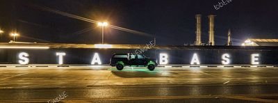 SUV Silhouette at Starbase Night